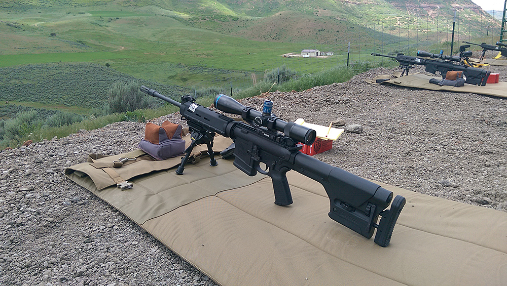 Once we had our rifles dialed on the bench and could ding the 16"x16" plates out to 1,000 yards, it was time to go outside the shoot house and try some different positions. Working with Caldwell bipods and BlackHawk! shooting mats, we learned how to "load" the bipod, position our bodies and work to keep the rifle and our breathing as stable as possible. The Magpul PRS stock could adjust quickly to the new body position as well, helping this lanky shooter get in the right place behind the optic.