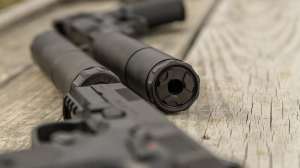 TR Suppressor story pistol with suppressor beauty on table PHOTO BY MATT PORTER