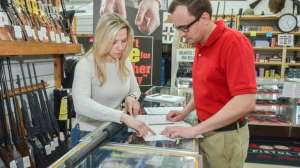 Customer Shopping in retail store fiearms by NSSF