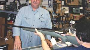 Customer trying rifle fit