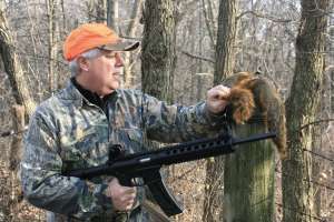 Rimfire Return hunter with SW 22 rifle and squirrels