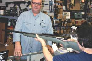 Customer trying rifle fit