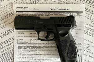 NICS Forms with pistol